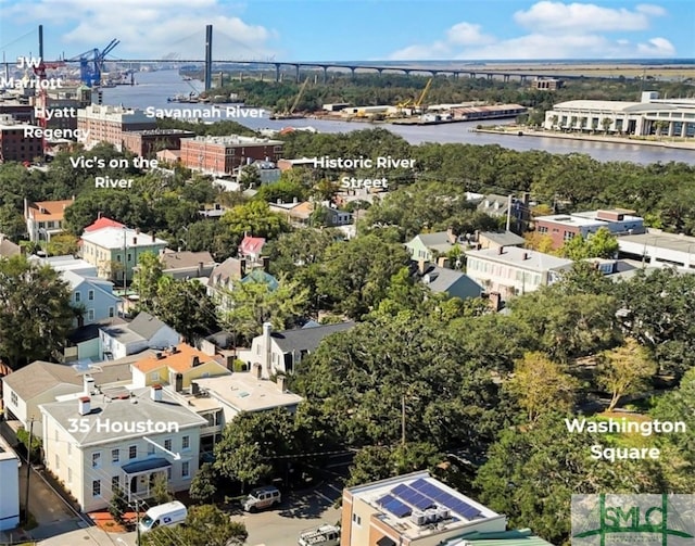 birds eye view of property with a water view