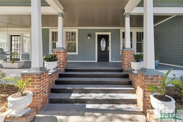 doorway to property with covered porch