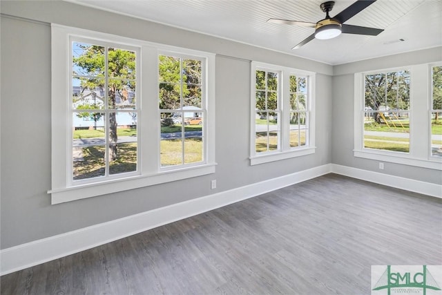 unfurnished sunroom featuring visible vents and plenty of natural light
