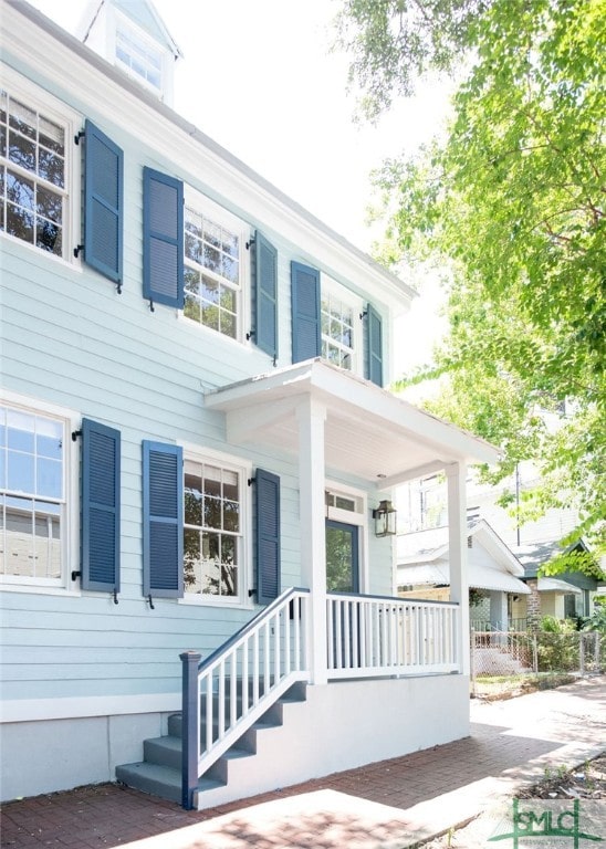 doorway to property with a porch