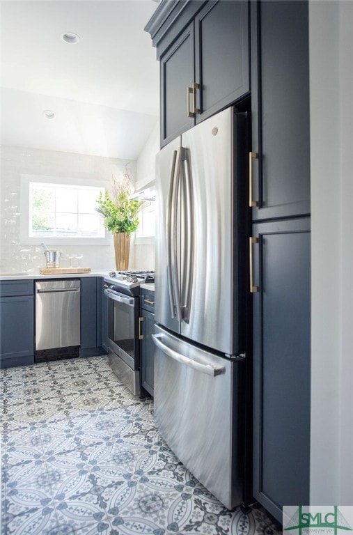 kitchen with decorative backsplash and appliances with stainless steel finishes