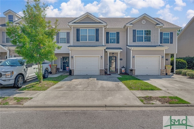 townhome / multi-family property featuring a garage