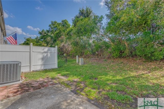 view of yard featuring central AC