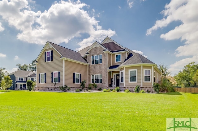 craftsman-style house with a front lawn