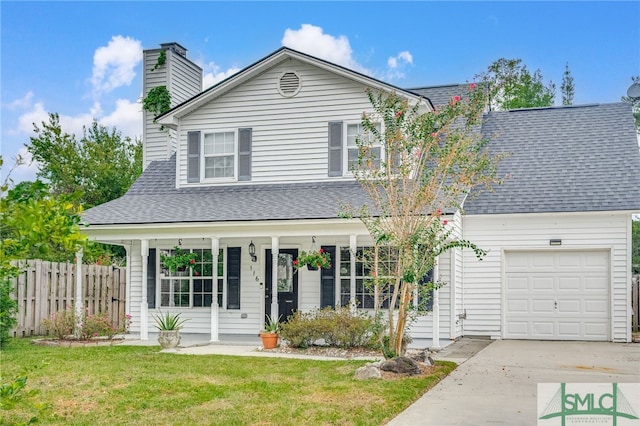 front of property featuring a front yard and a garage