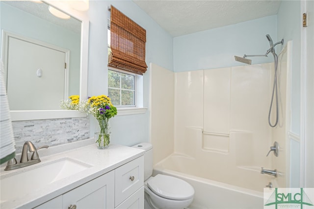 bathroom with vanity, tub / shower combination, toilet, a textured ceiling, and backsplash