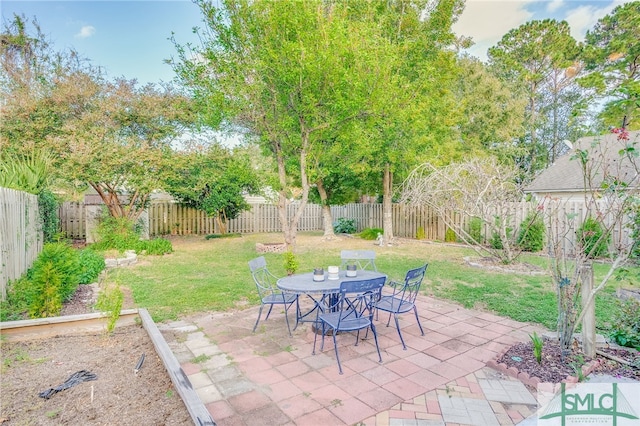 view of patio / terrace with a fenced backyard and outdoor dining area