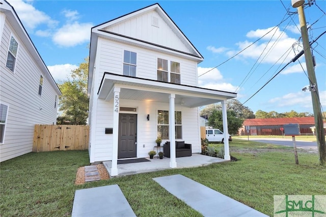 view of front of house featuring a front yard and a porch