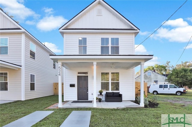 front facade featuring a front yard and a porch