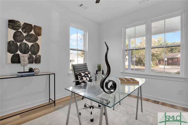 office space with light hardwood / wood-style flooring