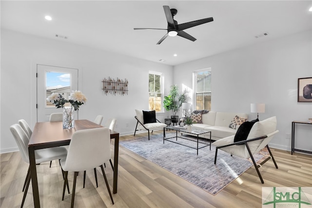 dining area featuring ceiling fan and light hardwood / wood-style flooring