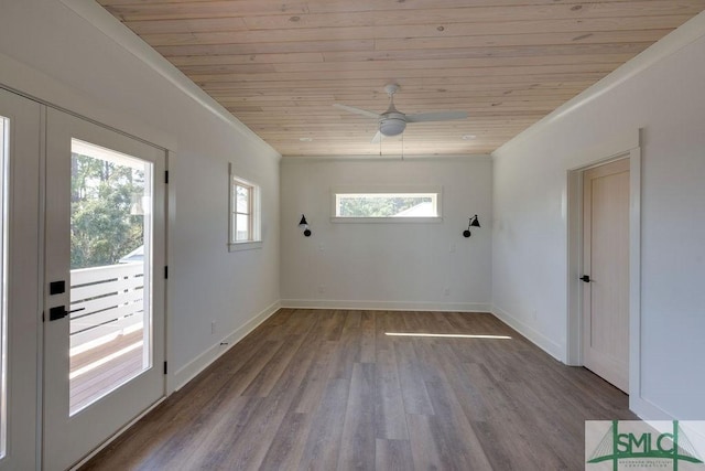 interior space featuring light wood-type flooring, ceiling fan, ornamental molding, and wood ceiling