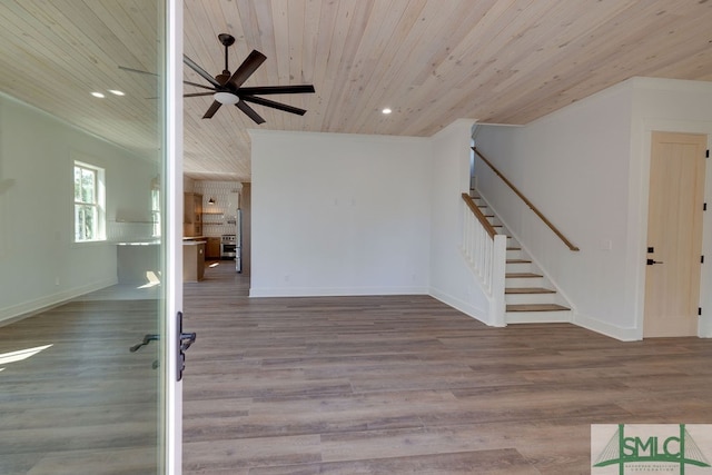 interior space featuring ceiling fan, wood-type flooring, and wooden ceiling