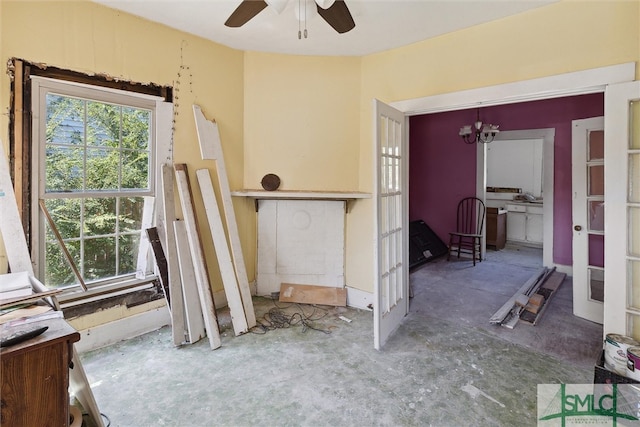 interior space featuring concrete flooring and ceiling fan