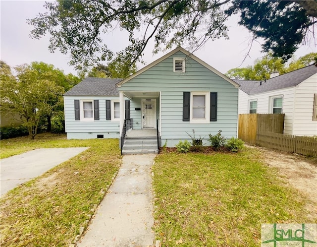 bungalow with a front lawn