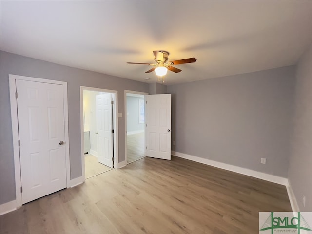 unfurnished bedroom with light wood-type flooring and ceiling fan