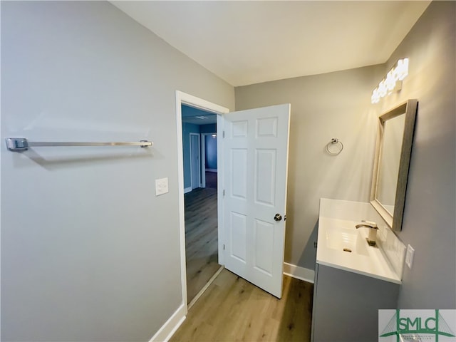 bathroom featuring vanity and wood-type flooring