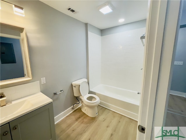 full bathroom featuring vanity, toilet, shower / tub combination, and hardwood / wood-style floors