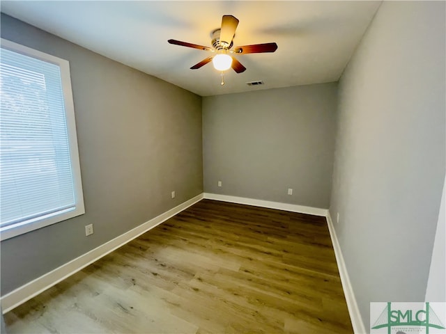 empty room featuring hardwood / wood-style flooring and ceiling fan