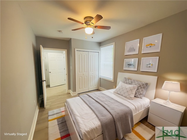 bedroom with a closet, ceiling fan, and light hardwood / wood-style floors