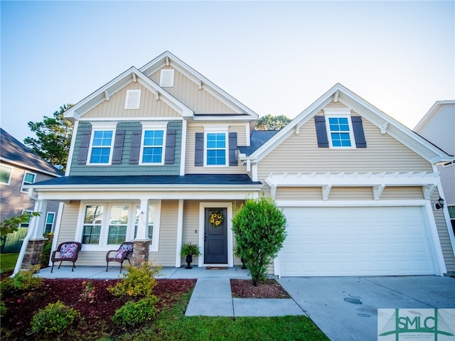 craftsman inspired home with covered porch and a garage