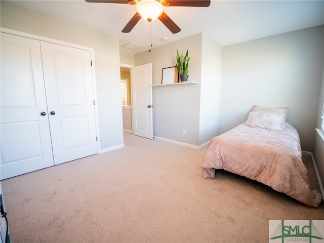 bedroom featuring carpet flooring, a closet, and ceiling fan