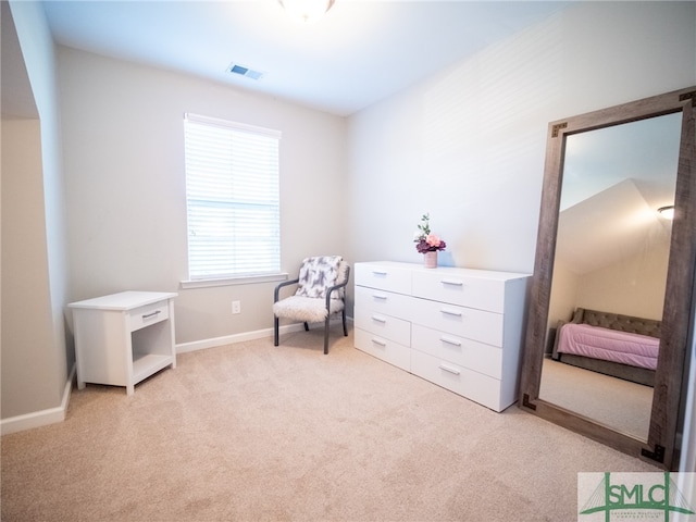 living area with light carpet