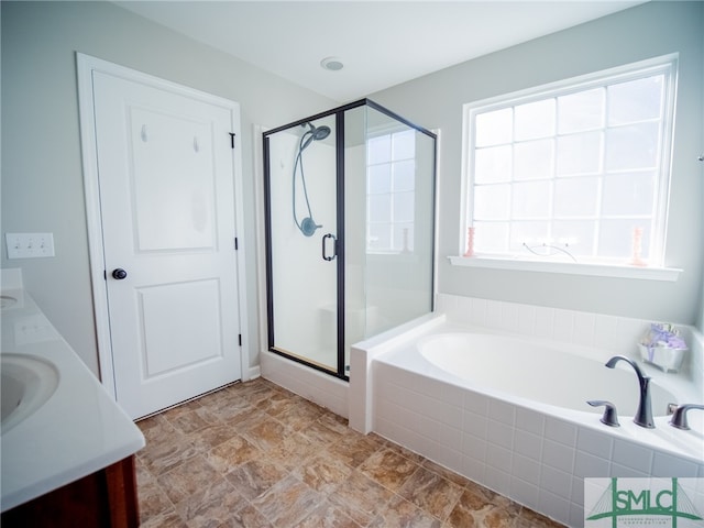 bathroom with plus walk in shower and vanity