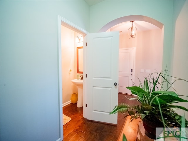 hallway with sink and dark hardwood / wood-style floors