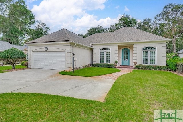 ranch-style house with a garage and a front lawn