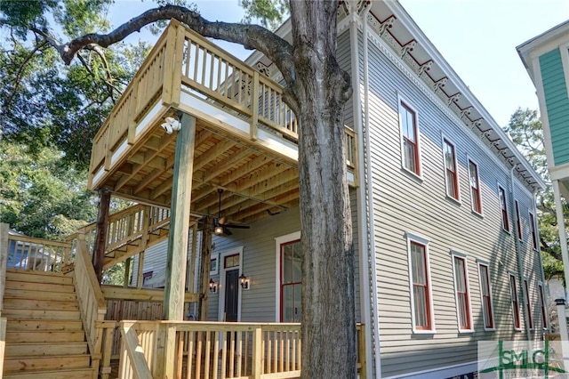 view of side of home with a balcony