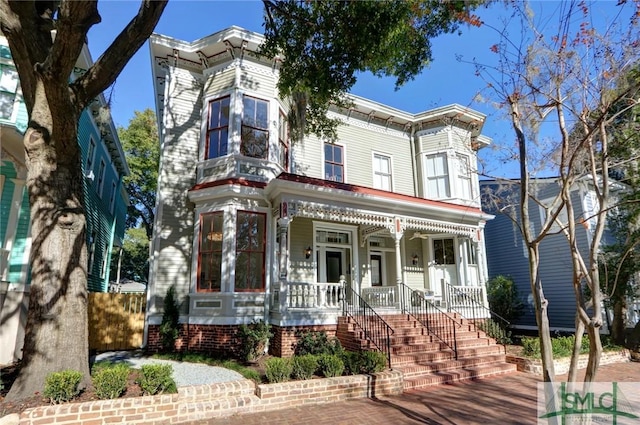 italianate home featuring a porch