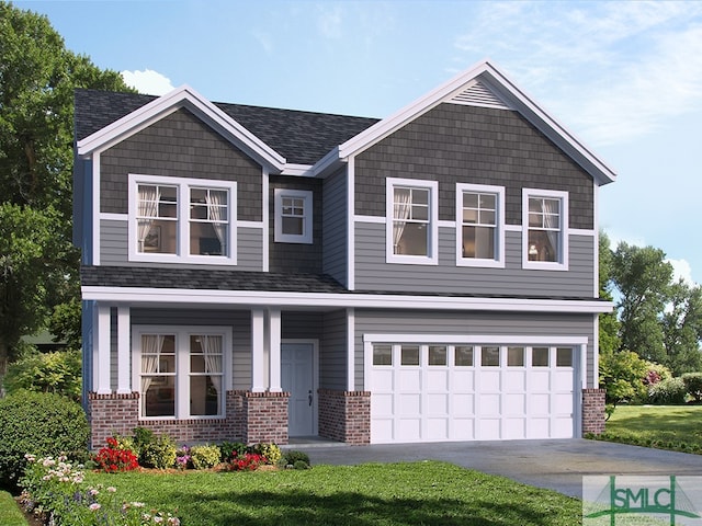 view of front of house featuring a garage and a front lawn