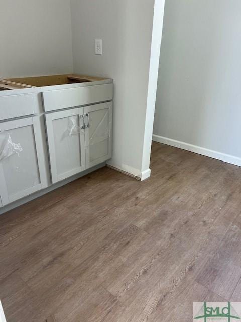 bathroom with hardwood / wood-style floors