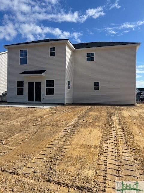 back of house with a patio