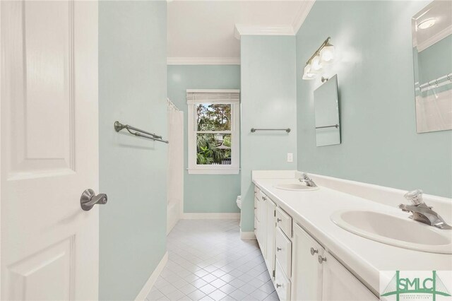 bathroom with tile patterned flooring, vanity, toilet, and crown molding