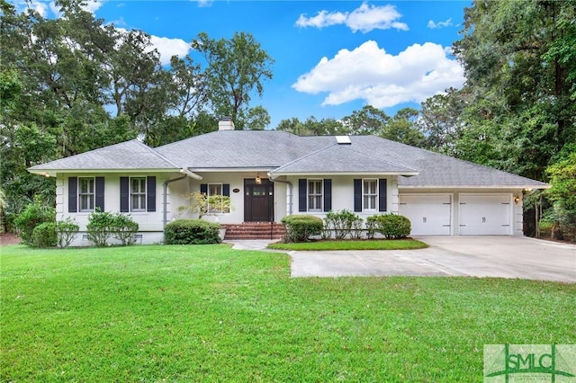 single story home featuring a garage and a front lawn