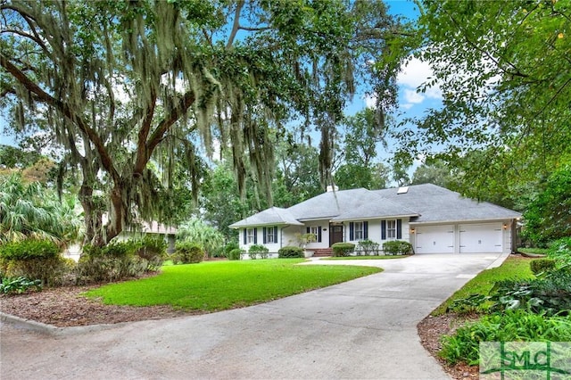 single story home featuring a front yard and a garage