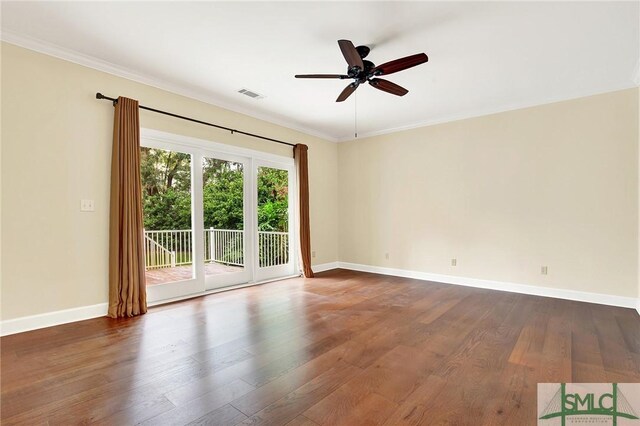 empty room featuring ceiling fan, dark hardwood / wood-style floors, and ornamental molding