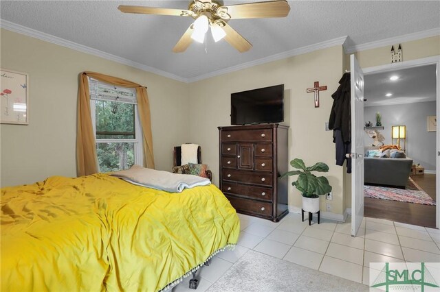 15 Cromwell Pl, Savannah, GA 31410 - bedroom featuring ornamental molding, light tile patterned floors, baseboards, a textured ceiling, and ceiling fan