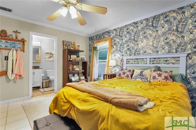 15 Cromwell Pl, Savannah, GA 31410 - bedroom with tile patterned flooring, ornamental molding, baseboards, connected bathroom, and a textured ceiling
