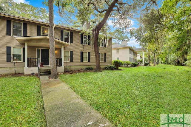 15 Cromwell Pl, Savannah, GA 31410 - view of front of house featuring a front lawn and a chimney