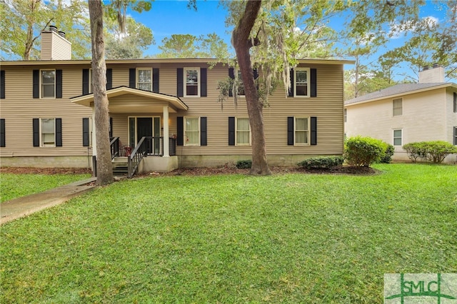 view of front of house with a front lawn