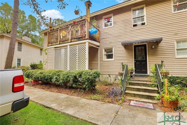 15 Cromwell Pl, Savannah, GA 31410 - rear view of house featuring a balcony