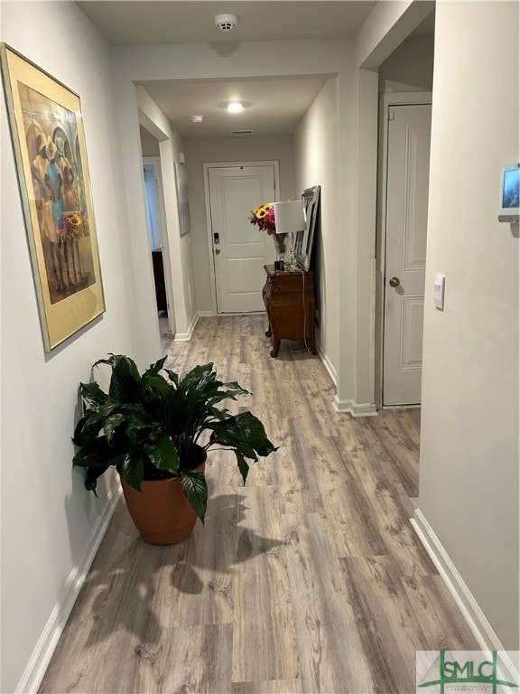 hallway featuring light wood-type flooring