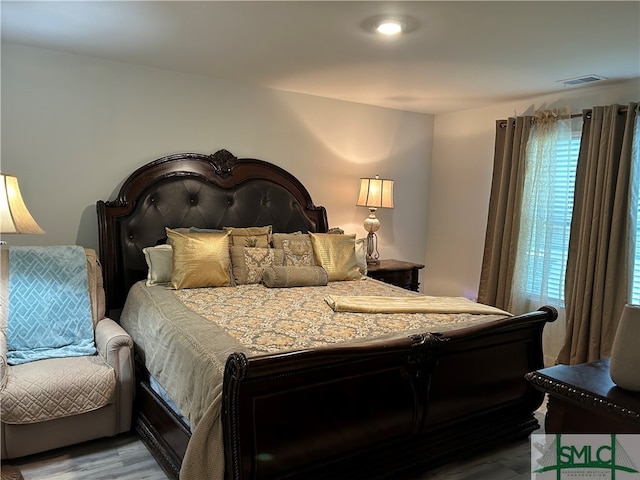 bedroom featuring wood-type flooring