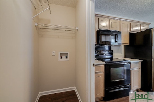 kitchen featuring a textured ceiling, light brown cabinetry, black appliances, and dark hardwood / wood-style flooring