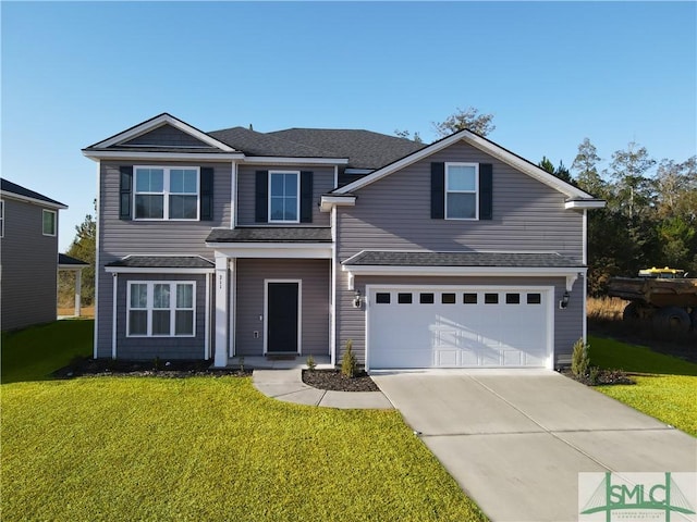 front facade featuring a front lawn and a garage