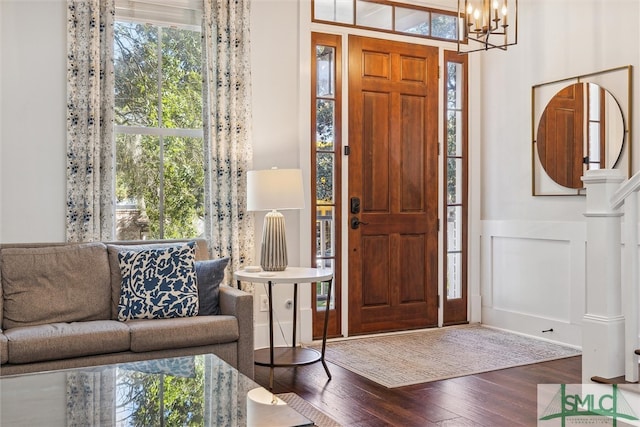 foyer entrance featuring a notable chandelier and hardwood / wood-style floors