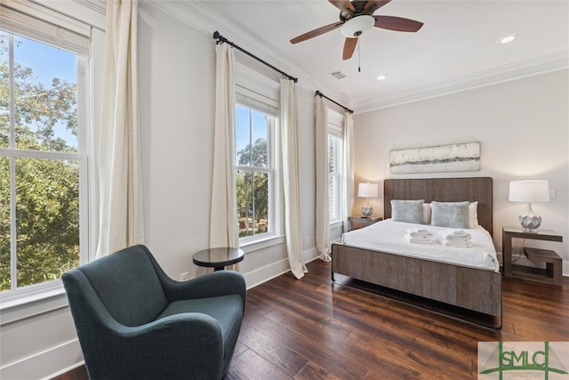 bedroom featuring ornamental molding, ceiling fan, and dark wood-type flooring